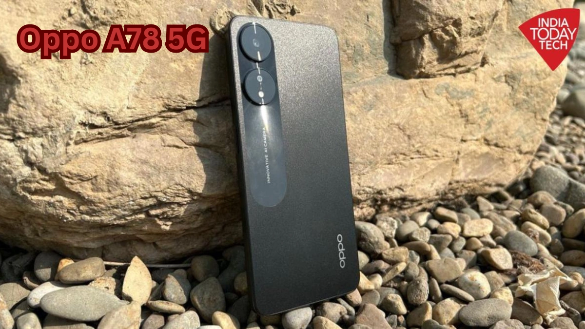 Oppo A78 5G smartphone rear design showing dual camera setup and premium matte finish placed on rocky surface